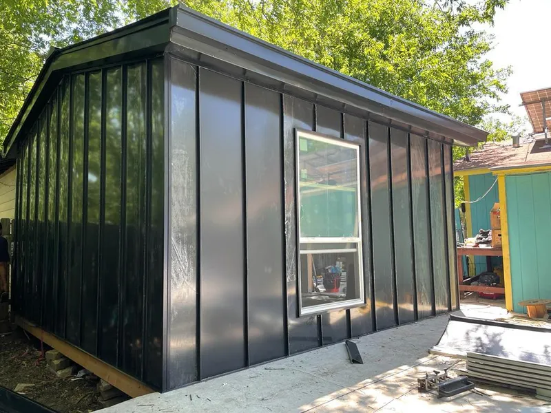 Black standing seam metal wall panels for Roof Inspection in Gresham